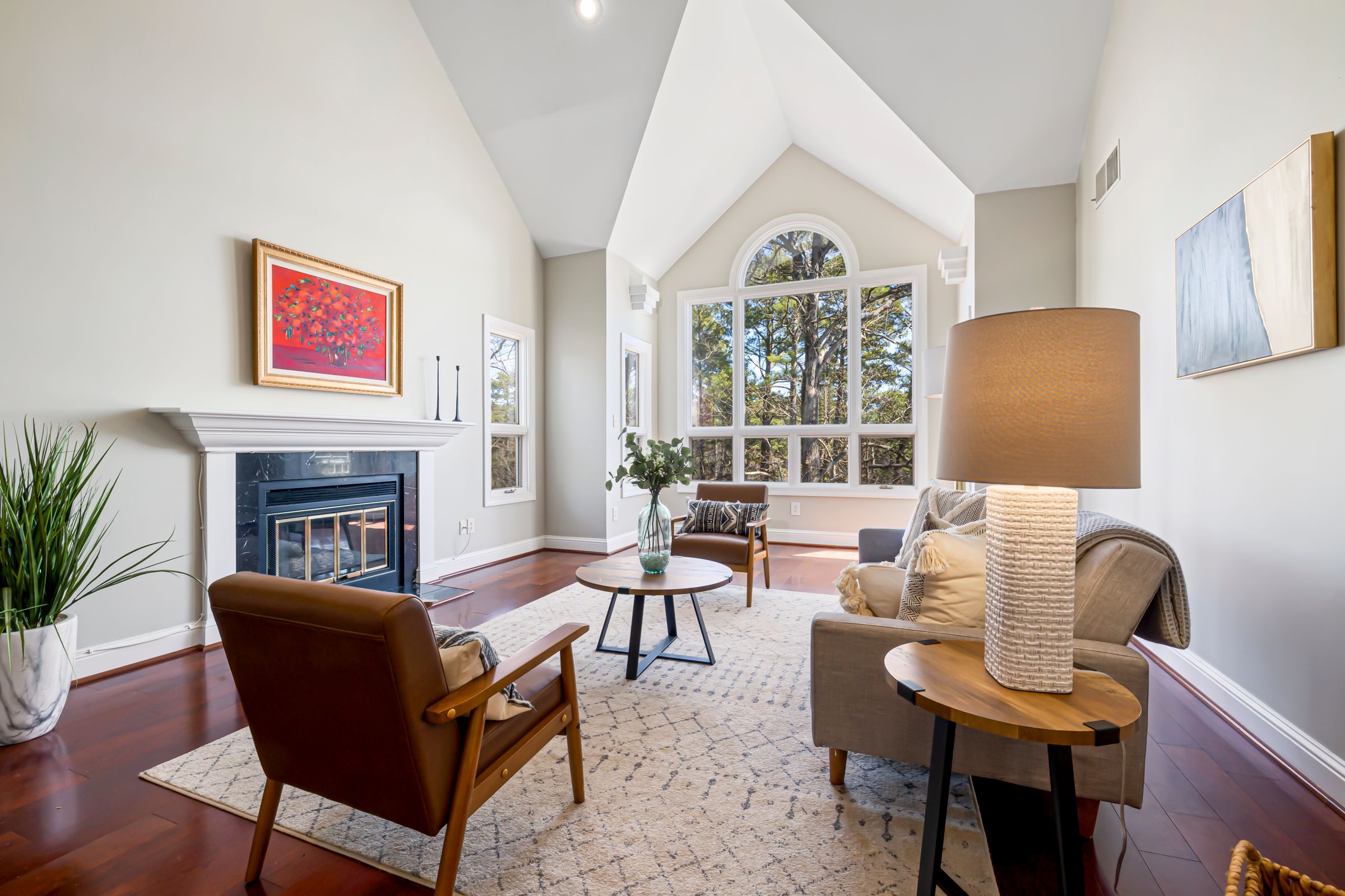 Traditional living room with neutral walls, a white fireplace mantel, and wood furnishings
